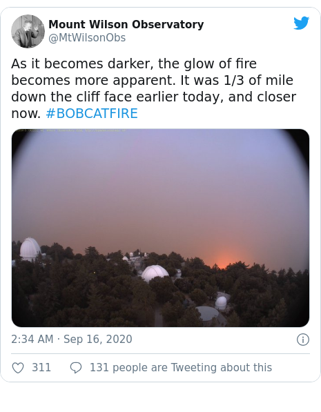 Twitter post by @MtWilsonObs: As it becomes darker, the glow of fire becomes more apparent. It was 1/3 of mile down the cliff face earlier today, and closer now. #BOBCATFIRE 