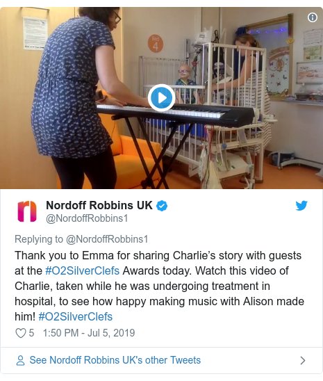 Twitter post by @NordoffRobbins1: Thank you to Emma for sharing Charlie’s story with guests at the #O2SilverClefs Awards today. Watch this video of Charlie, taken while he was undergoing treatment in hospital, to see how happy making music with Alison made him! #O2SilverClefs 