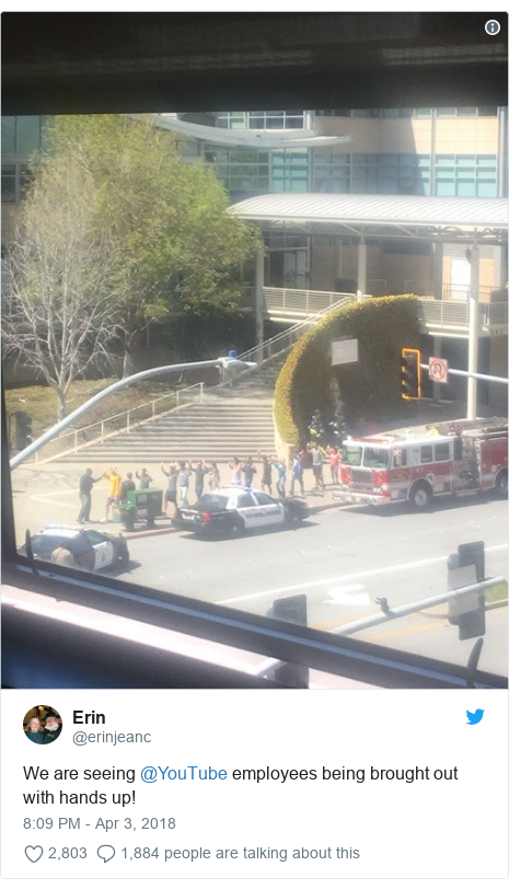 Twitter post by @erinjeanc: We are seeing @YouTube employees being brought out with hands up! 