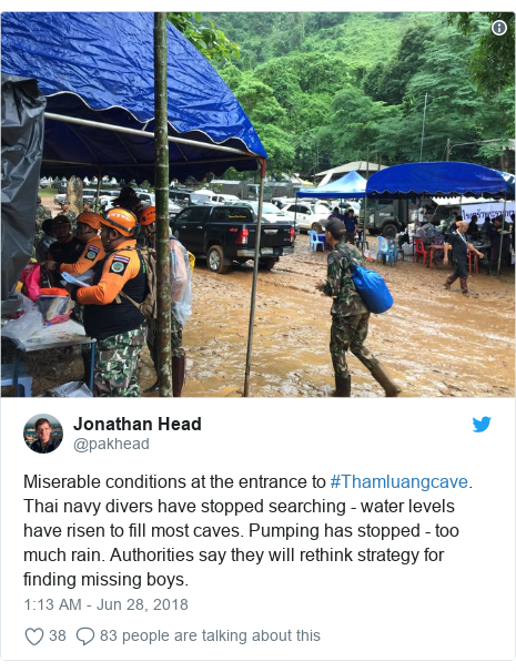 Twitter post by @pakhead: Miserable conditions at the entrance to #Thamluangcave. Thai navy divers have stopped searching - water levels have risen to fill most caves. Pumping has stopped - too much rain. Authorities say they will rethink strategy for finding missing boys. 