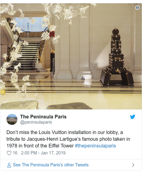 Twitter post by @peninsulaparis: Don’t miss the Louis Vuitton installation in our lobby, a tribute to Jacques-Henri Lartigue’s famous photo taken in 1978 in front of the Eiffel Tower #thepeninsulaparis 