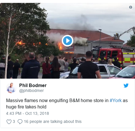 Twitter post by @philbodmer: Massive flames now engulfing B&M home store in #York as huge fire takes hold 