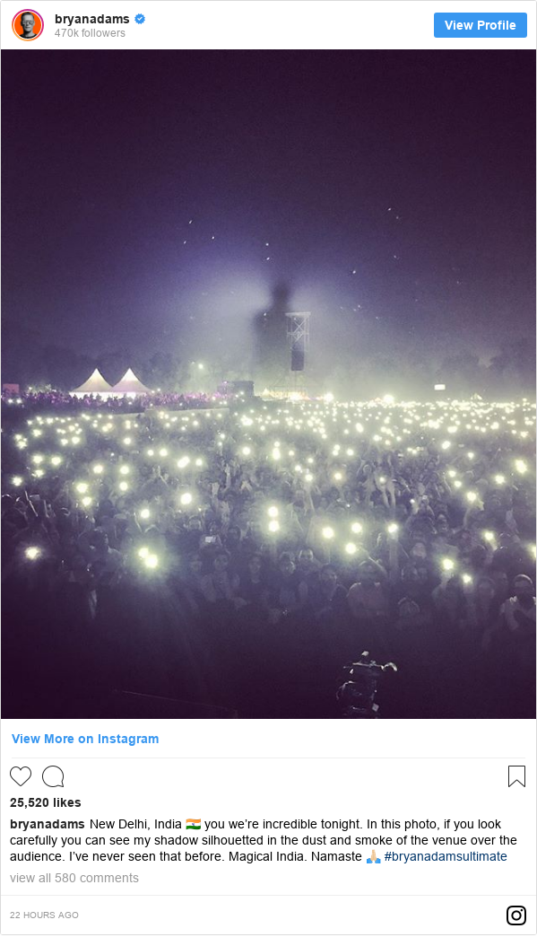 Instagram post by bryanadams: New Delhi, India ?? you we’re incredible tonight. In this photo, if you look carefully you can see my shadow silhouetted in the dust and smoke of the venue over the audience. I’ve never seen that before. Magical India. Namaste ?? #bryanadamsultimate