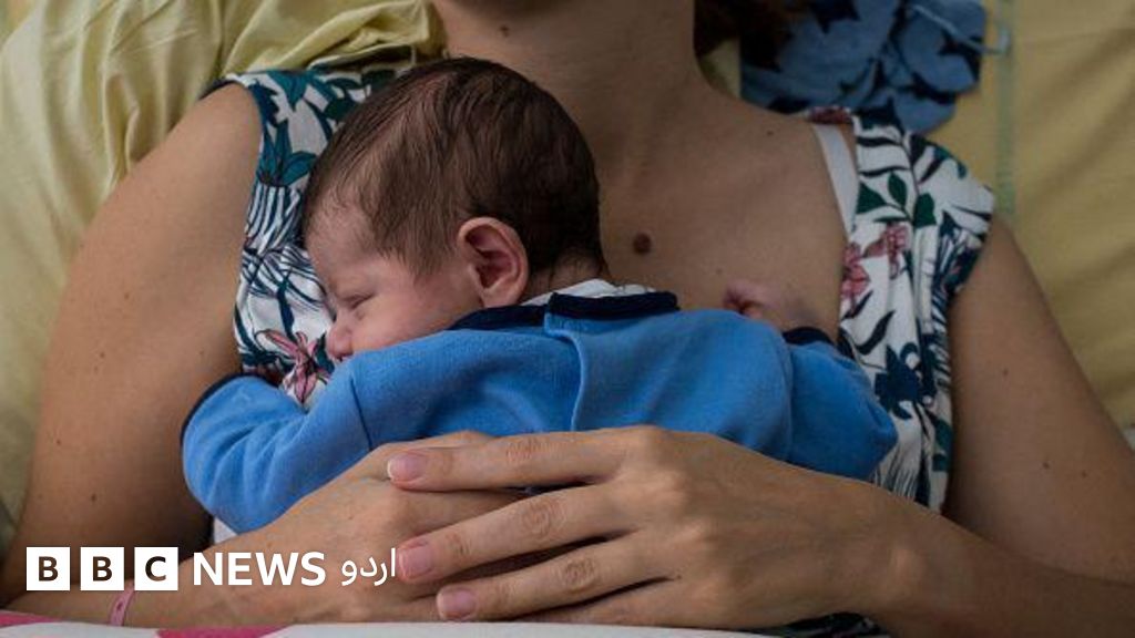 Illustration of an infant baby of only a few days old in his mother's arms after his birth at the Maternity Hospital in Paris, France, on August 23, 2018. Childbirth.