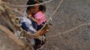 A man and child in an enclosure, El Paso