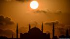 Silhouetted mosque at sunset