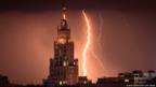 A lightning bolt strikes a skyscraper