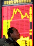 Chinese investor monitors stock exchange data