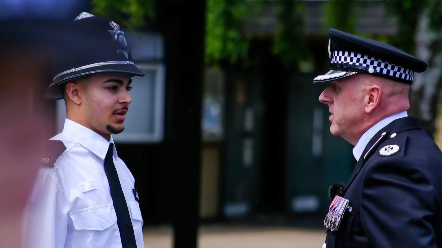 A police recruit with Assistant Chief Constable Vaughan Lukey