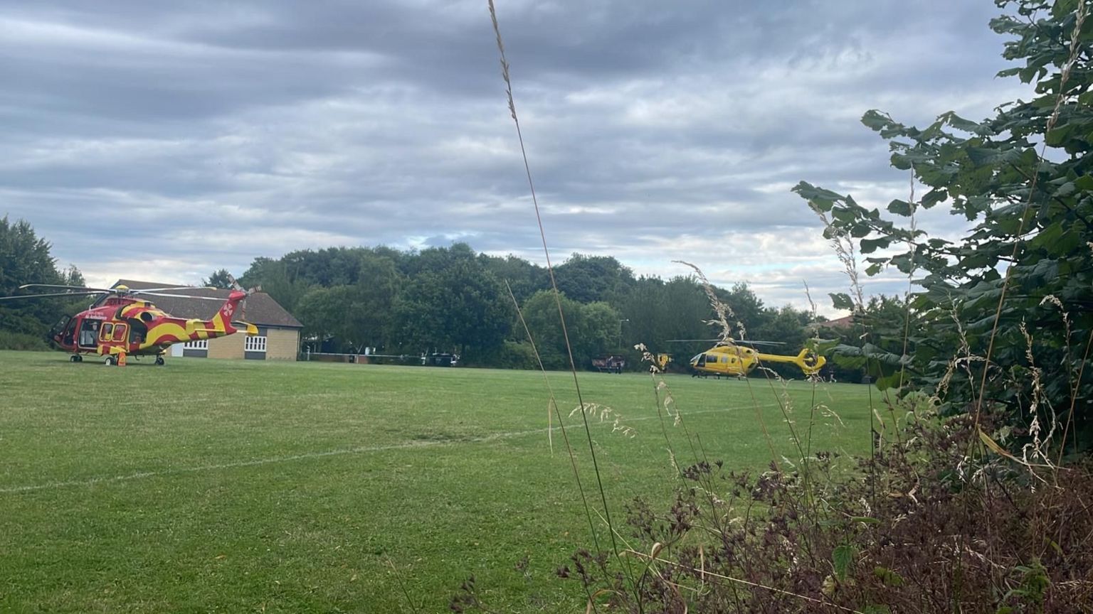 Two air ambulances landed in a field near Tallou Place