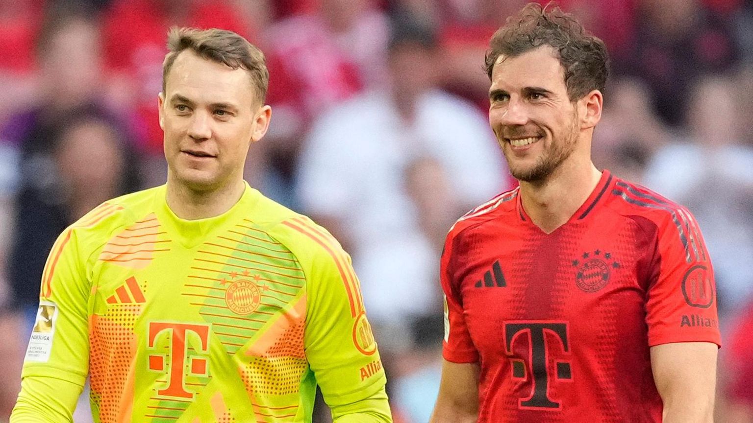 Manuel Neuer and Leon Goretzka smile after Bayern Munich's 2-0 win over Wolfsburg