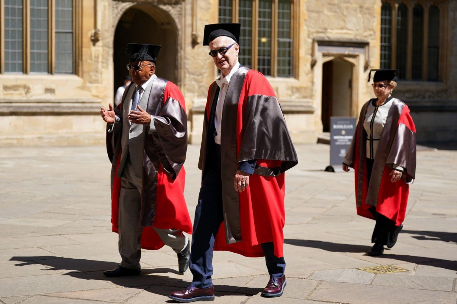 Filmmaker Wim Wenders walks in a procession ahead of receiving an honorary degree from Oxford University at a ceremony at Sheldonian Theatre, Oxford