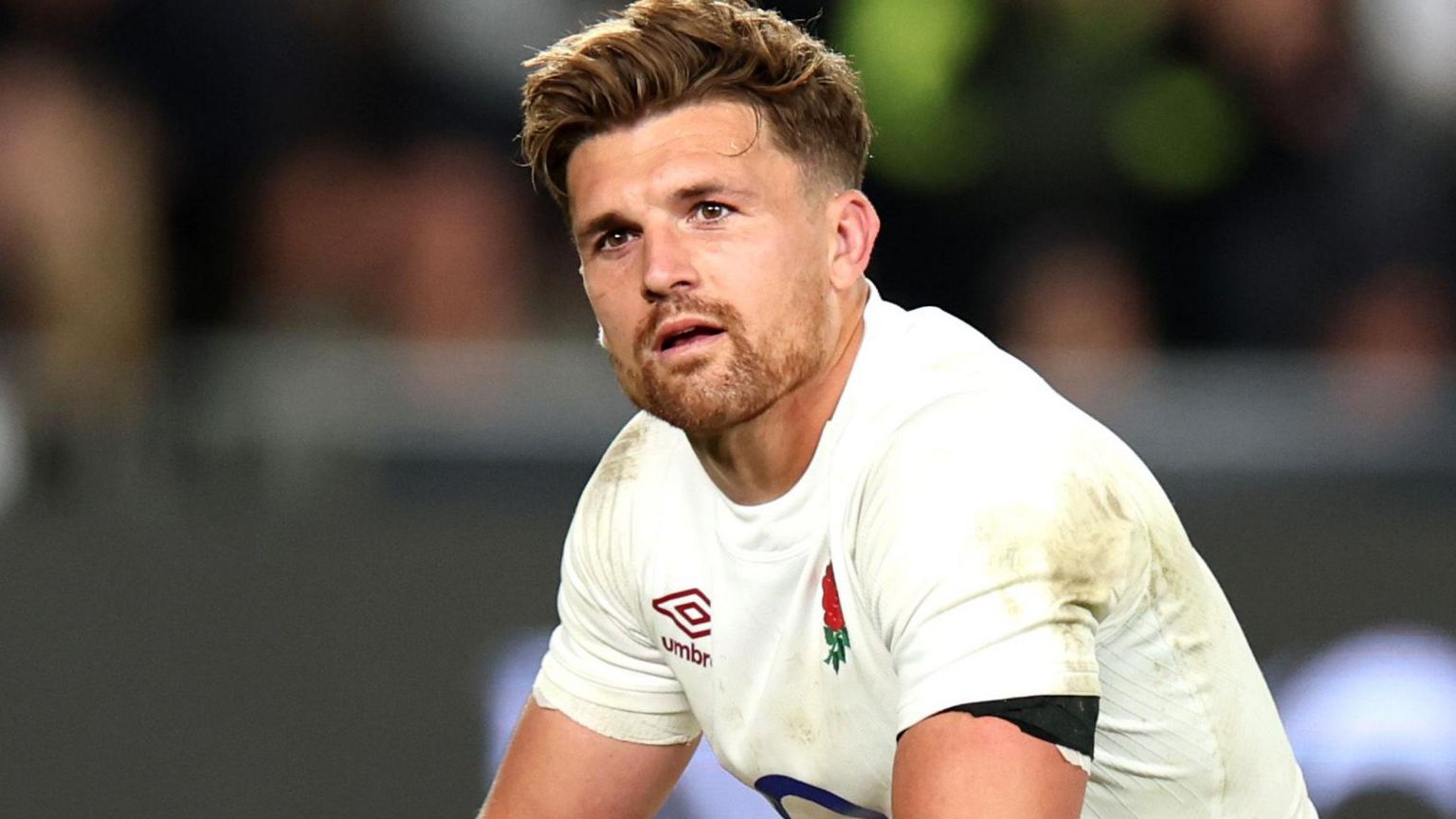 Henry Slade wearing an England rugby shirt