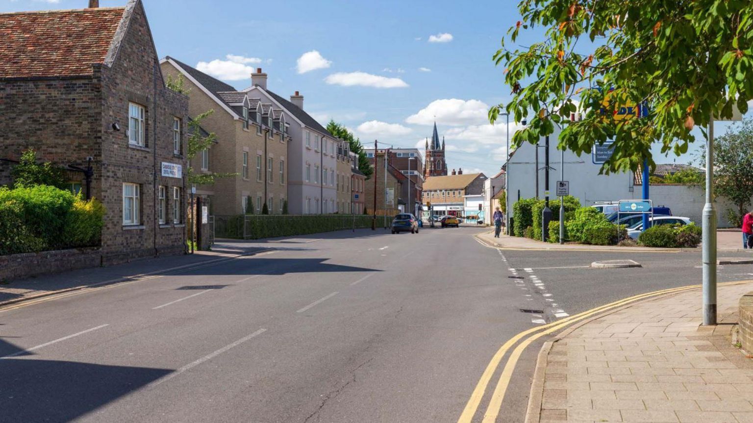 Illustrative image of what the proposed retirement homes on Cambridge Street in St Neots would look like, with the High Street and United Reformed Church in the background