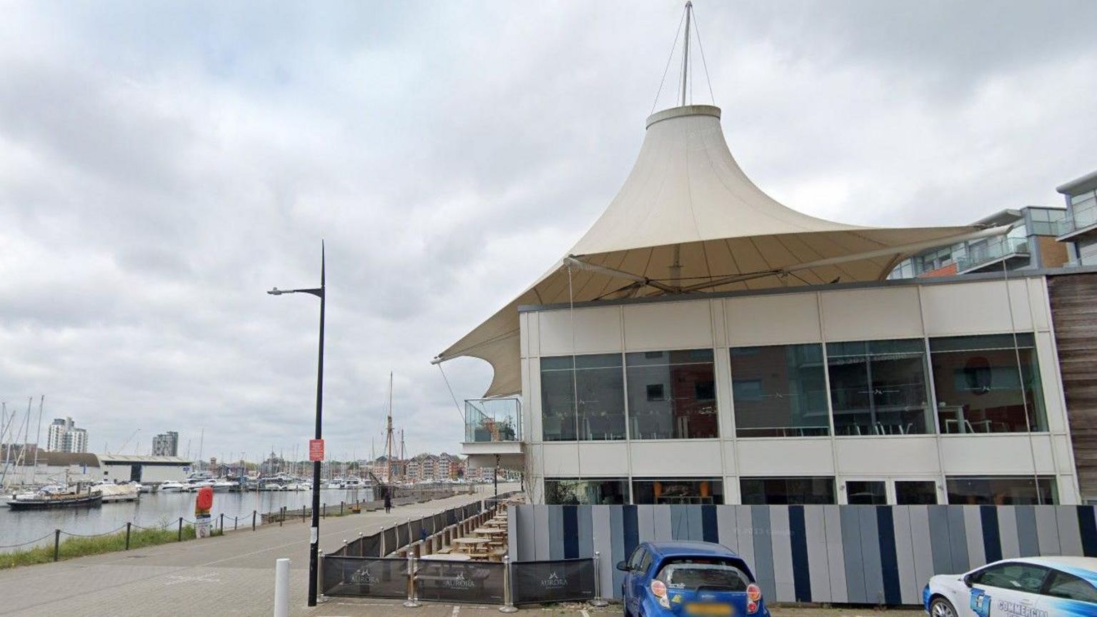 The side of A Listers at Aurora Bar, on Ipswich Waterfront, with two cars outside