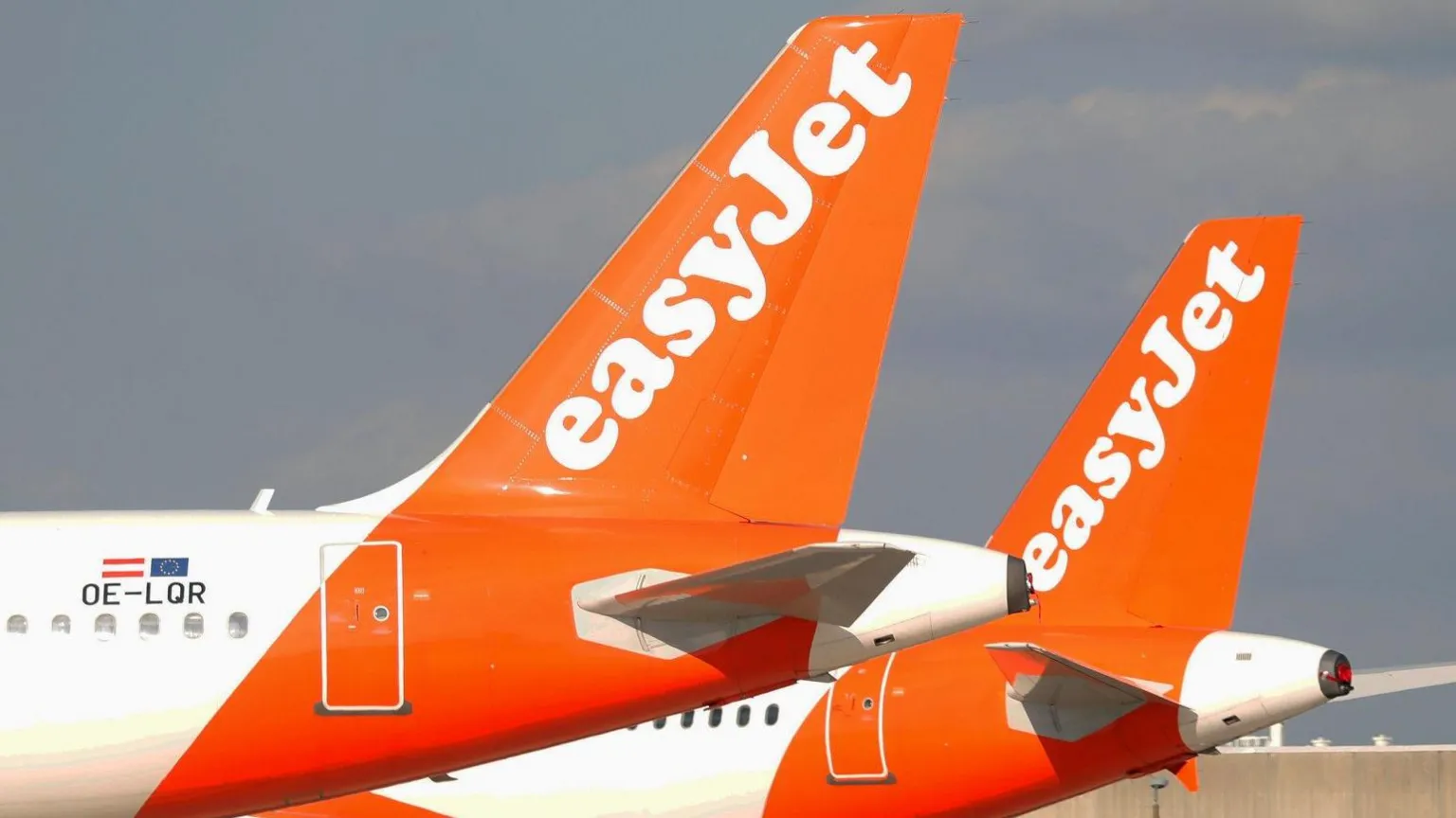 EasyJet takeover: tail fins of two parked EasyJet aircraft