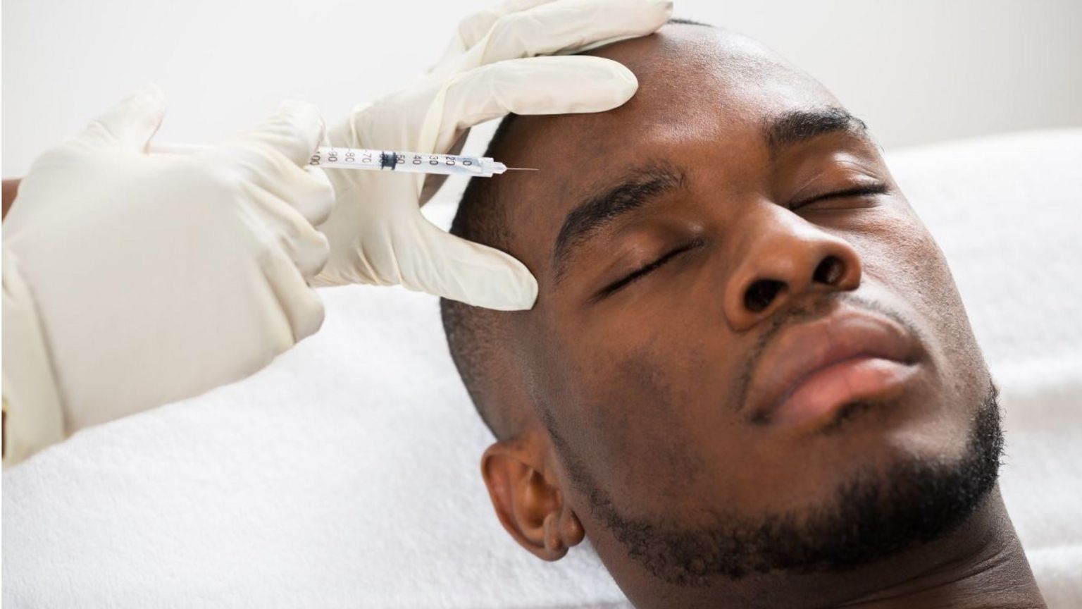 Man having forehead injected