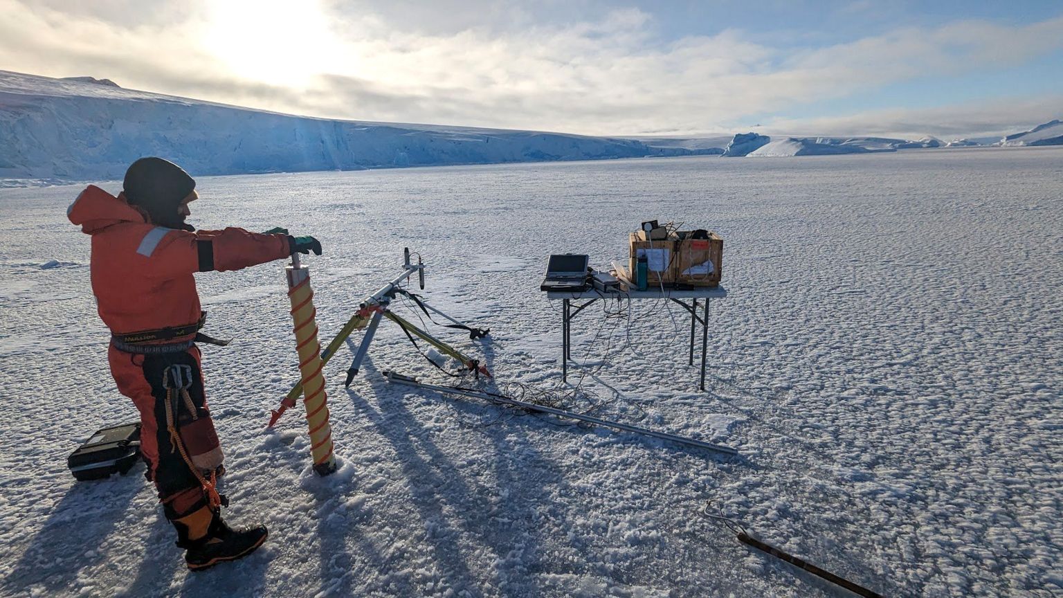 Scientists measuring the thickness of Antarctic ice