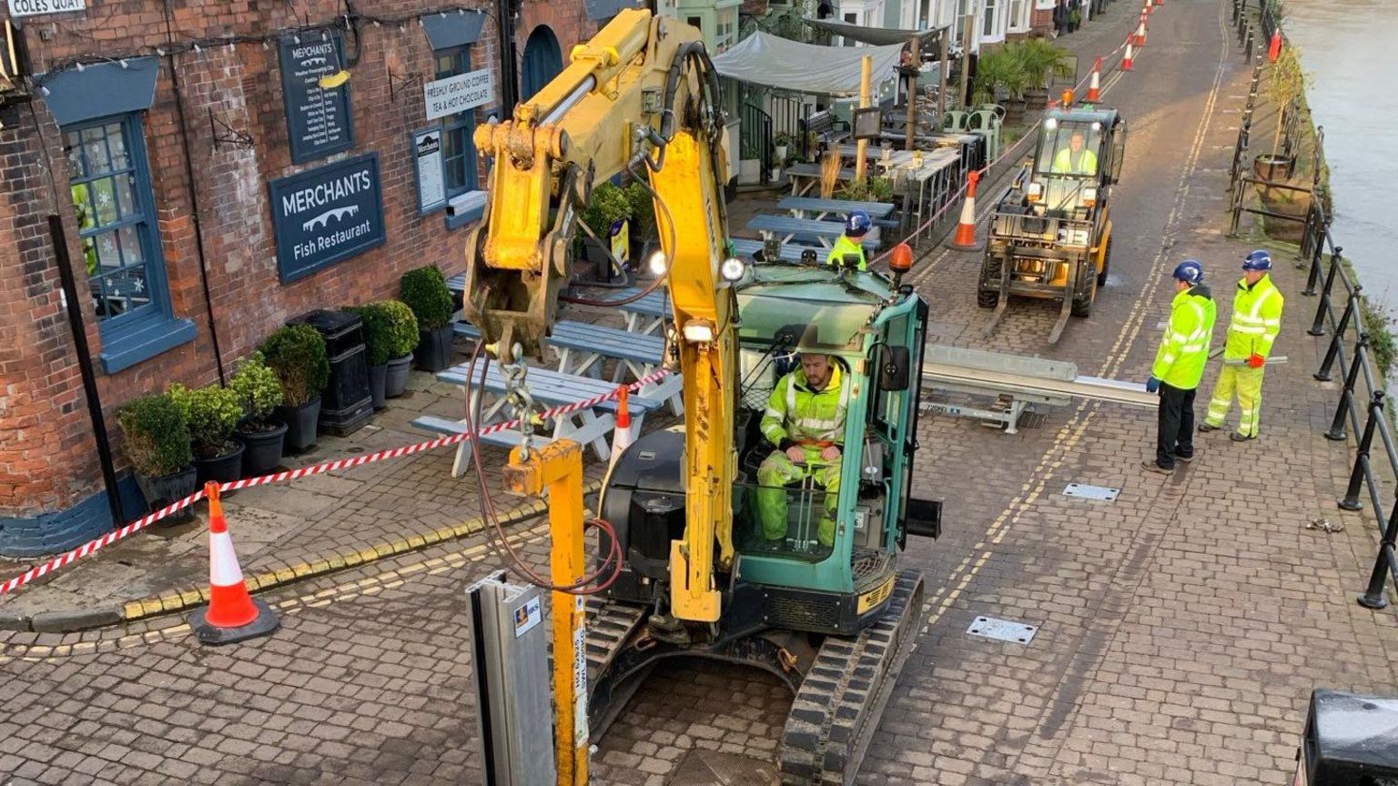 Workers setting up flood barriers in Bewdley