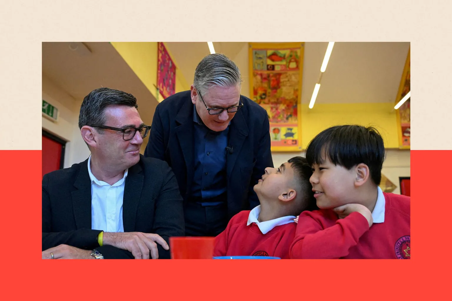 Reuters Britain's Prime Minister Keir Starmer meets school children at a breakfast club with Greater Manchester Mayor Andy Burnham
