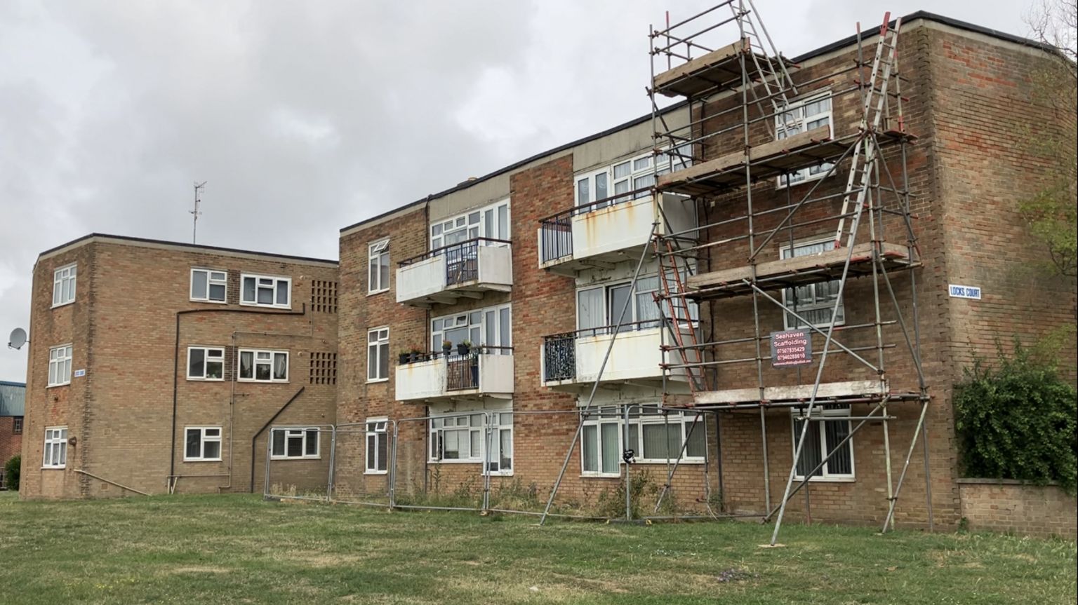 Exterior shot of Locks Court, Southwick, with scaffolding erected outside the block.