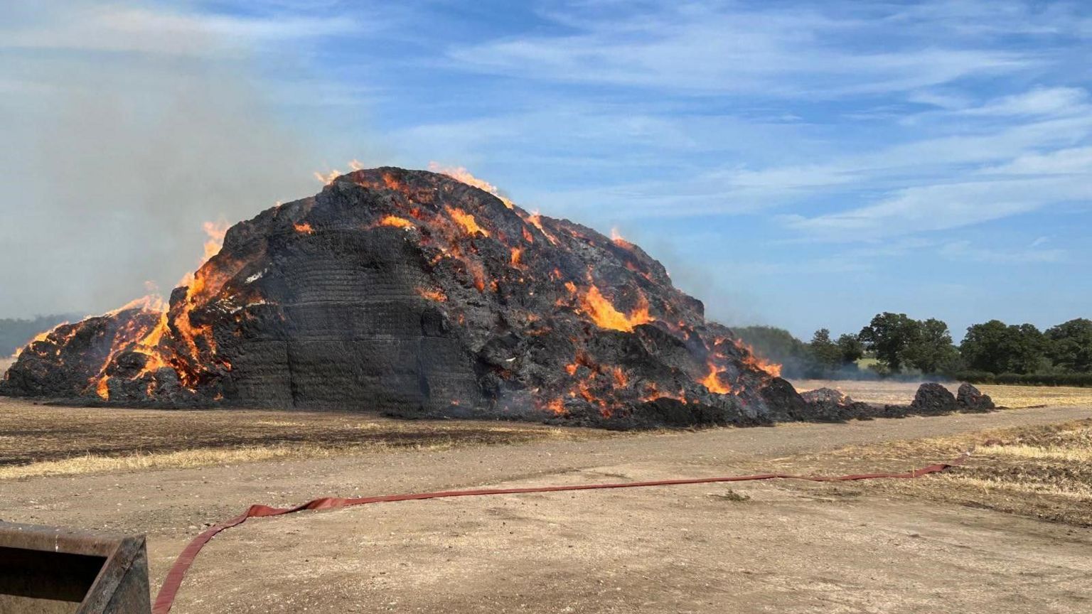 The stack of straw on fire