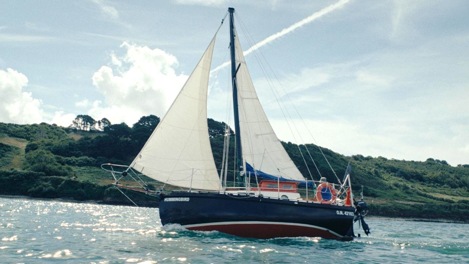 The yacht, Hummingird, under sail on the sea