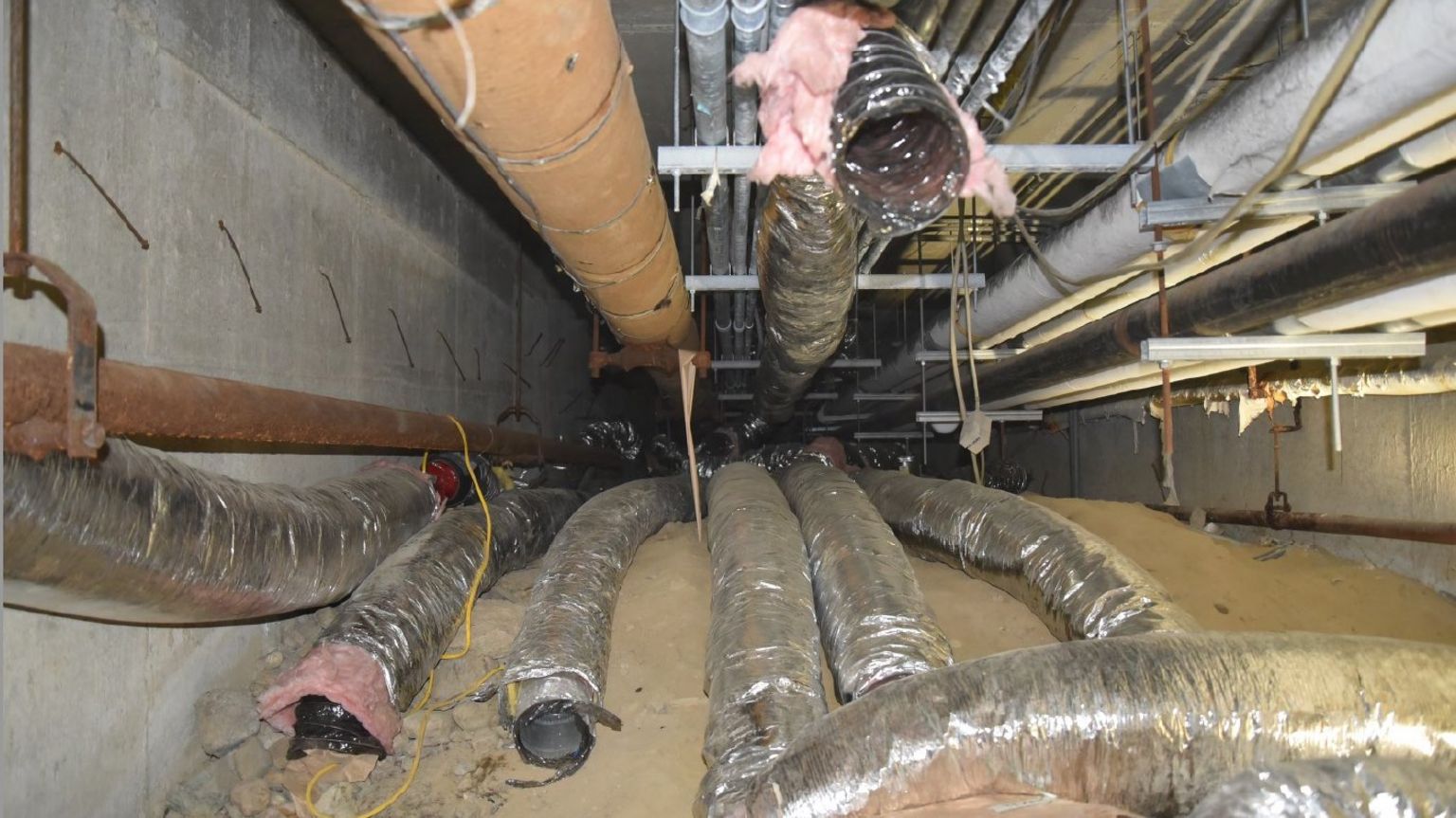 Photo of ducts set up underneath the school where the crypto mining operation took place