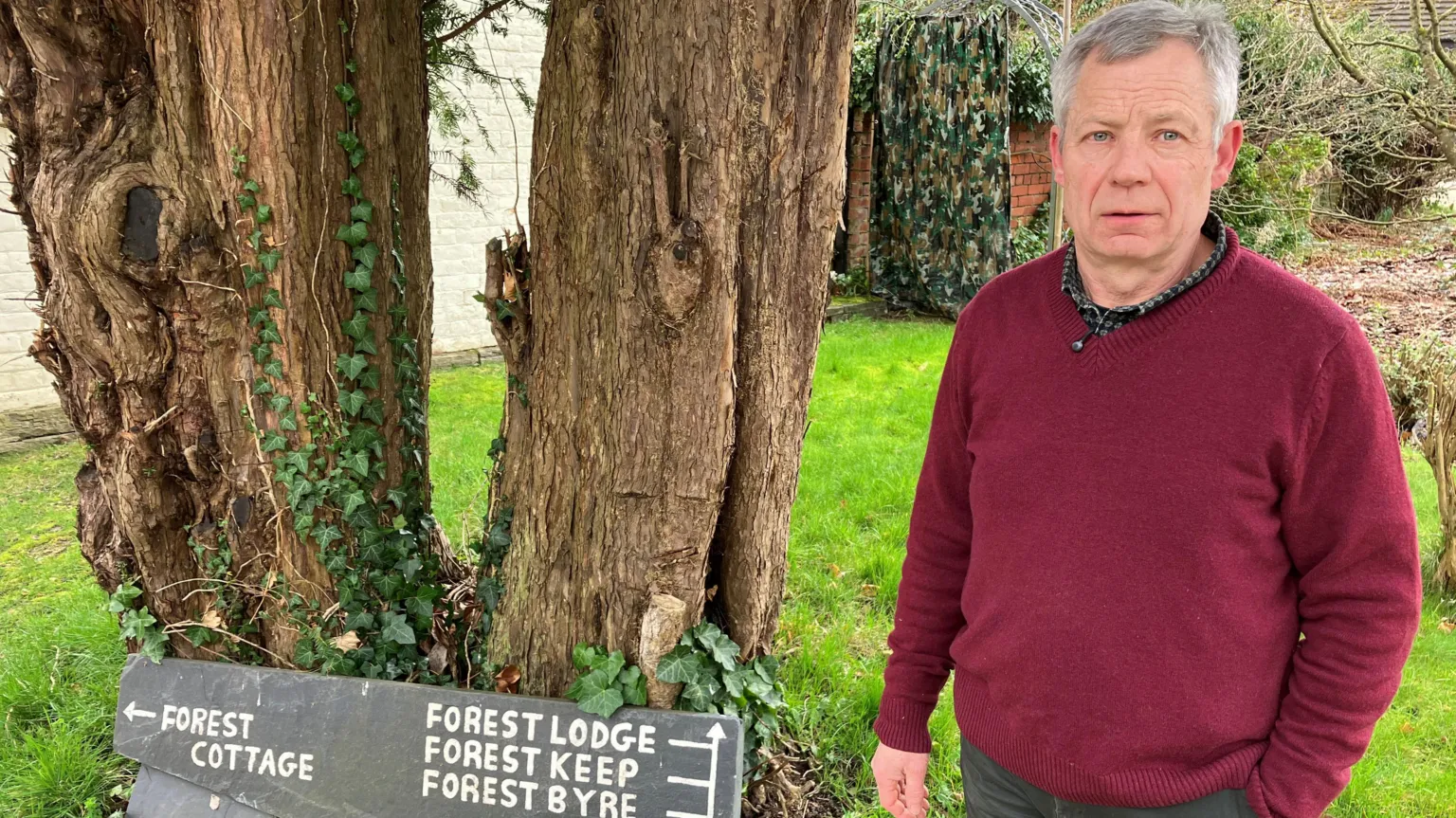 Paul Martin standing in front of his holiday cottages near Newtown, Powys