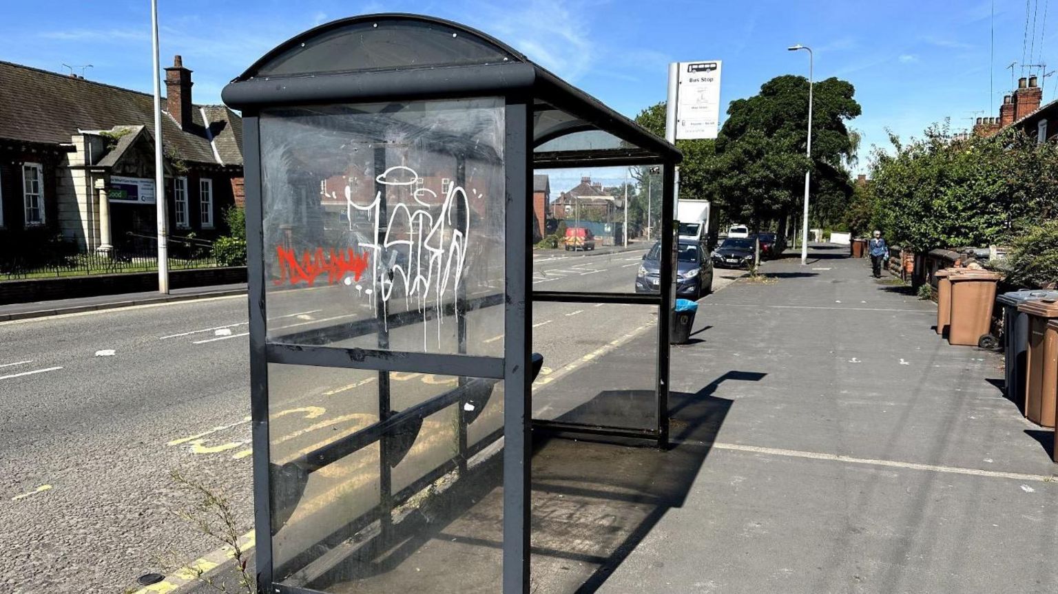 A bus shelter in Lincoln, covered in graffiti 