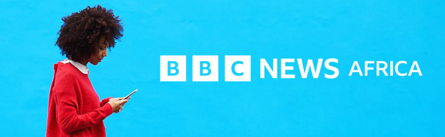 Getty Images/BBC A woman looking at her mobile phone and the graphic BBC News Africa