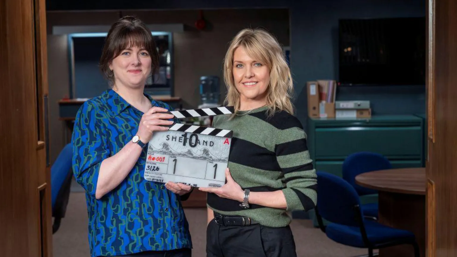 Alison O'Donnell and Ashley Jenson holding a clapper board which says Shetland on it.