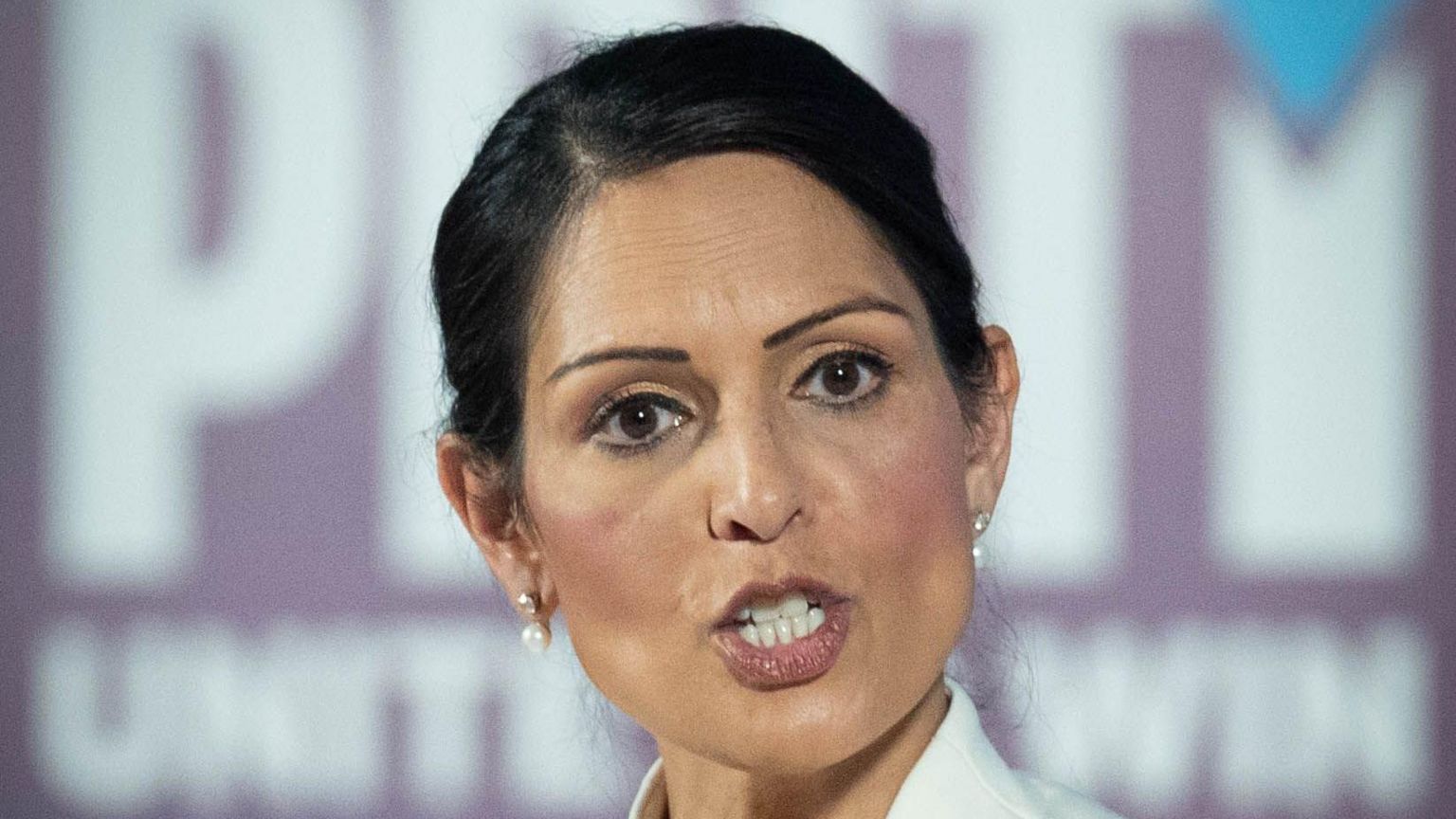 Priti Patel giving a speech in London