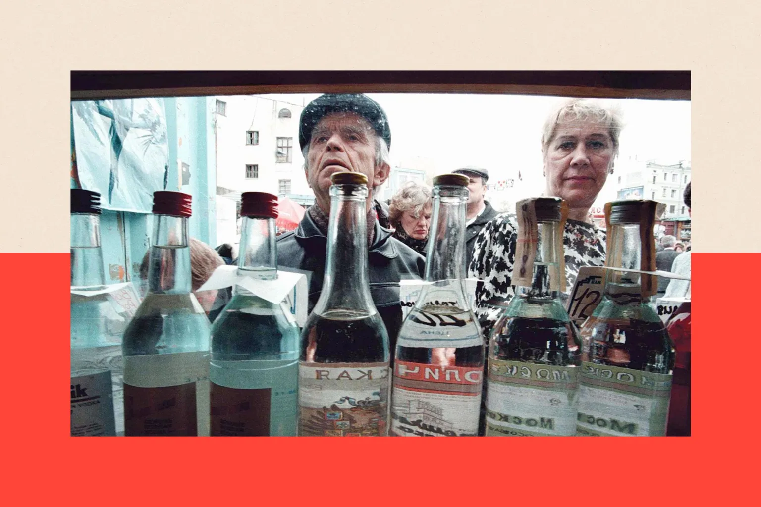AFP via Getty Images A man and a woman look into a kiosk selling various brands of vodka in clear bottles.