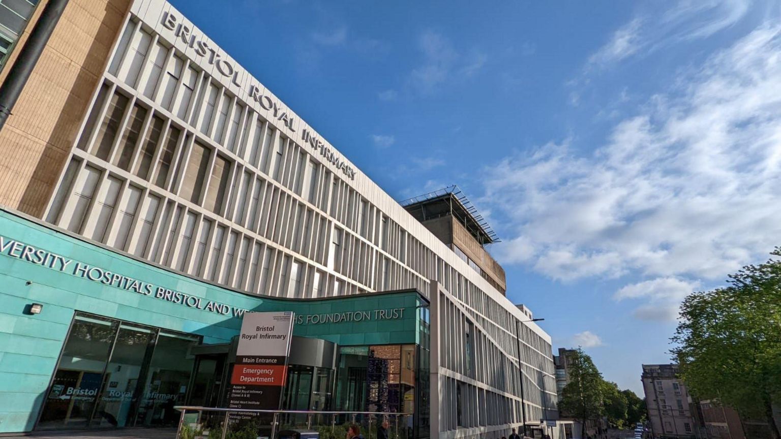 An external shot of Bristol Royal Infirmary with the green cladding on the main entrance visible