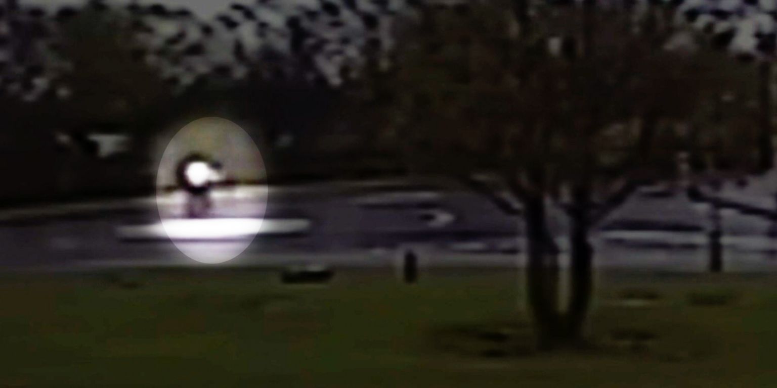 CCTV image of Sheku Bayoh walking erratically across a mini roundabout