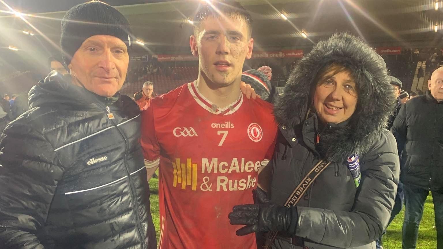 Niall Devlin with his mother and father