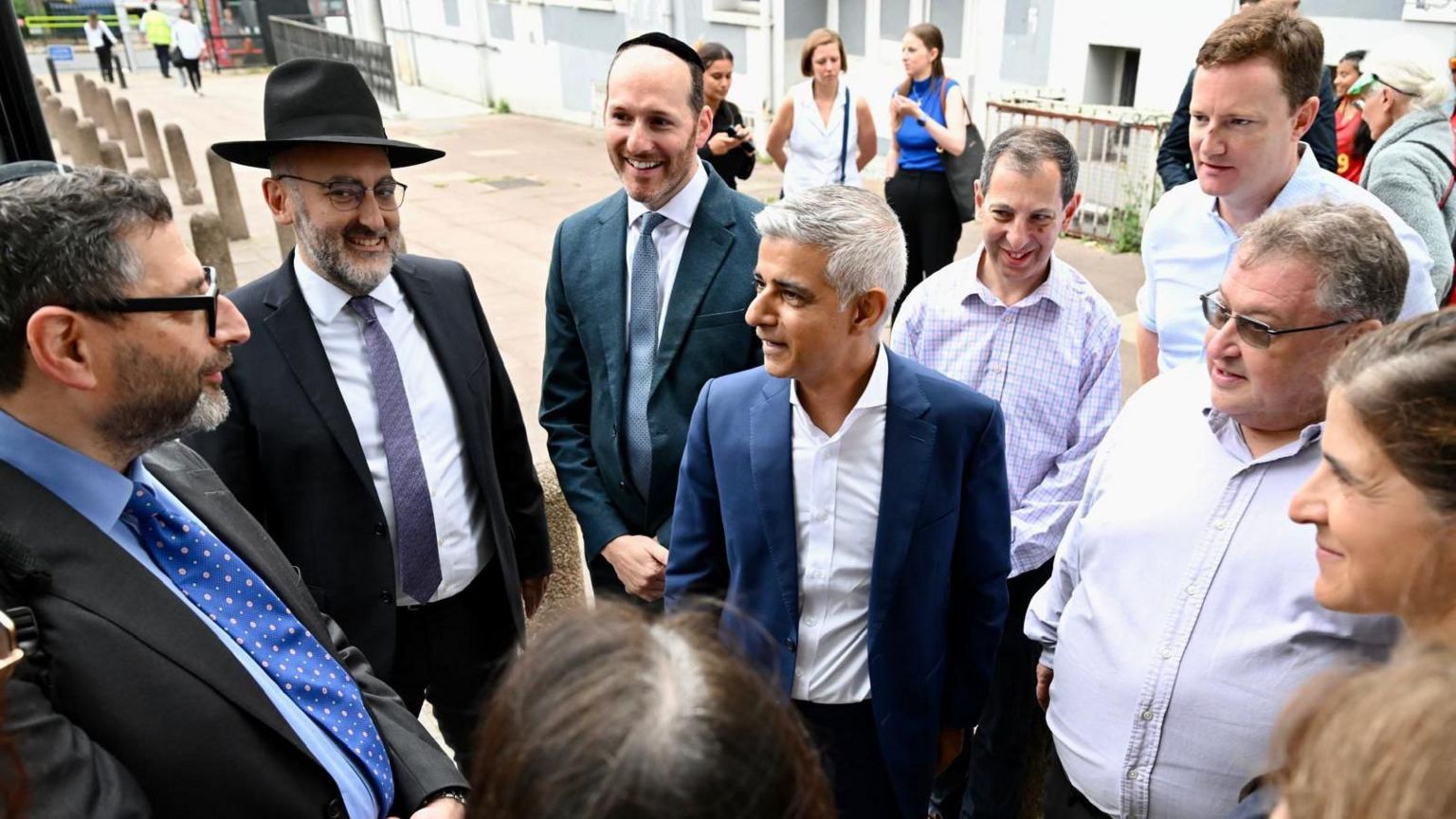 A group of people speak to the Mayor of London