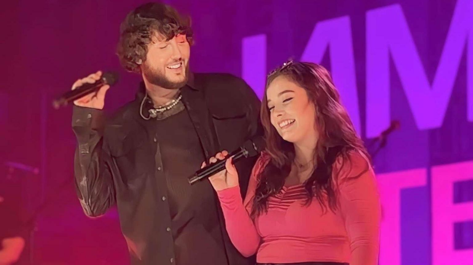 Milly Kirk on stage with James Arthur