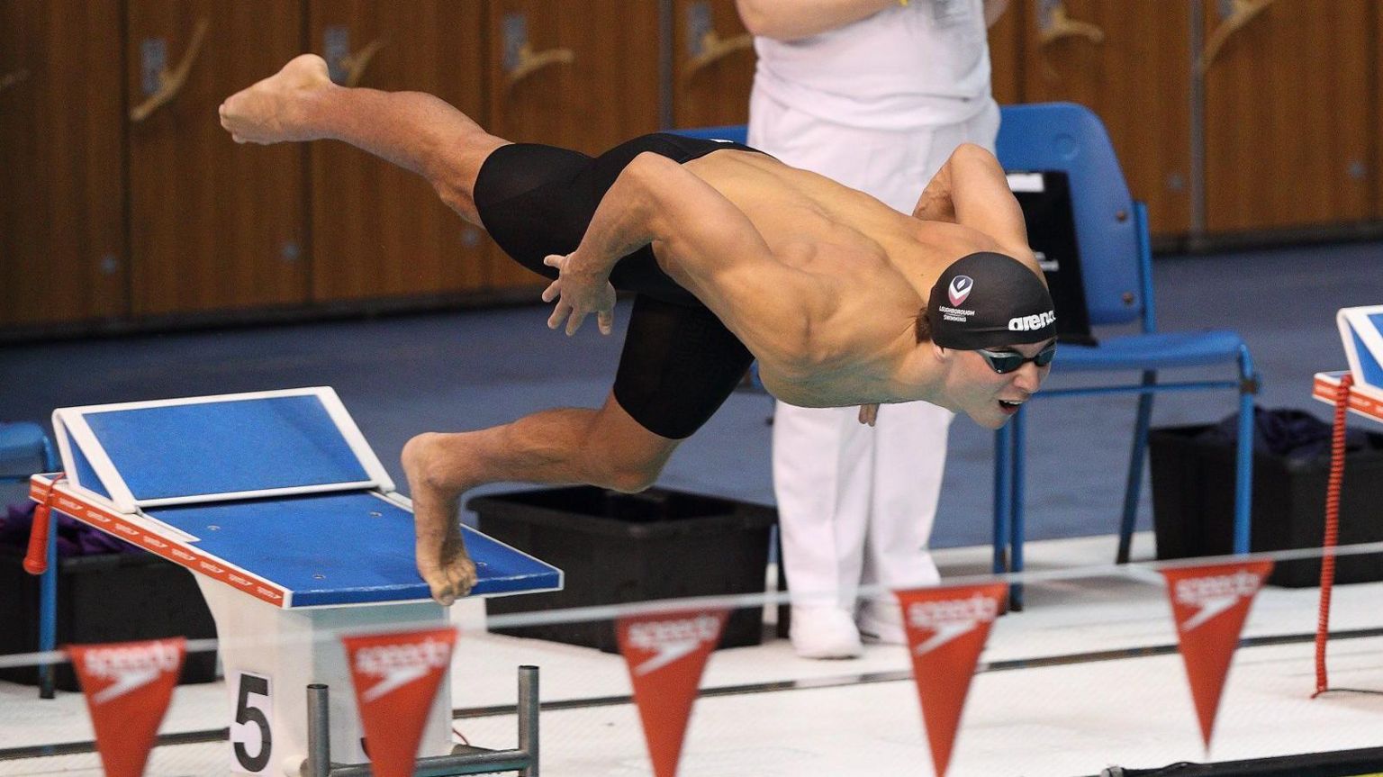 Alex Cohoon dives into the pool