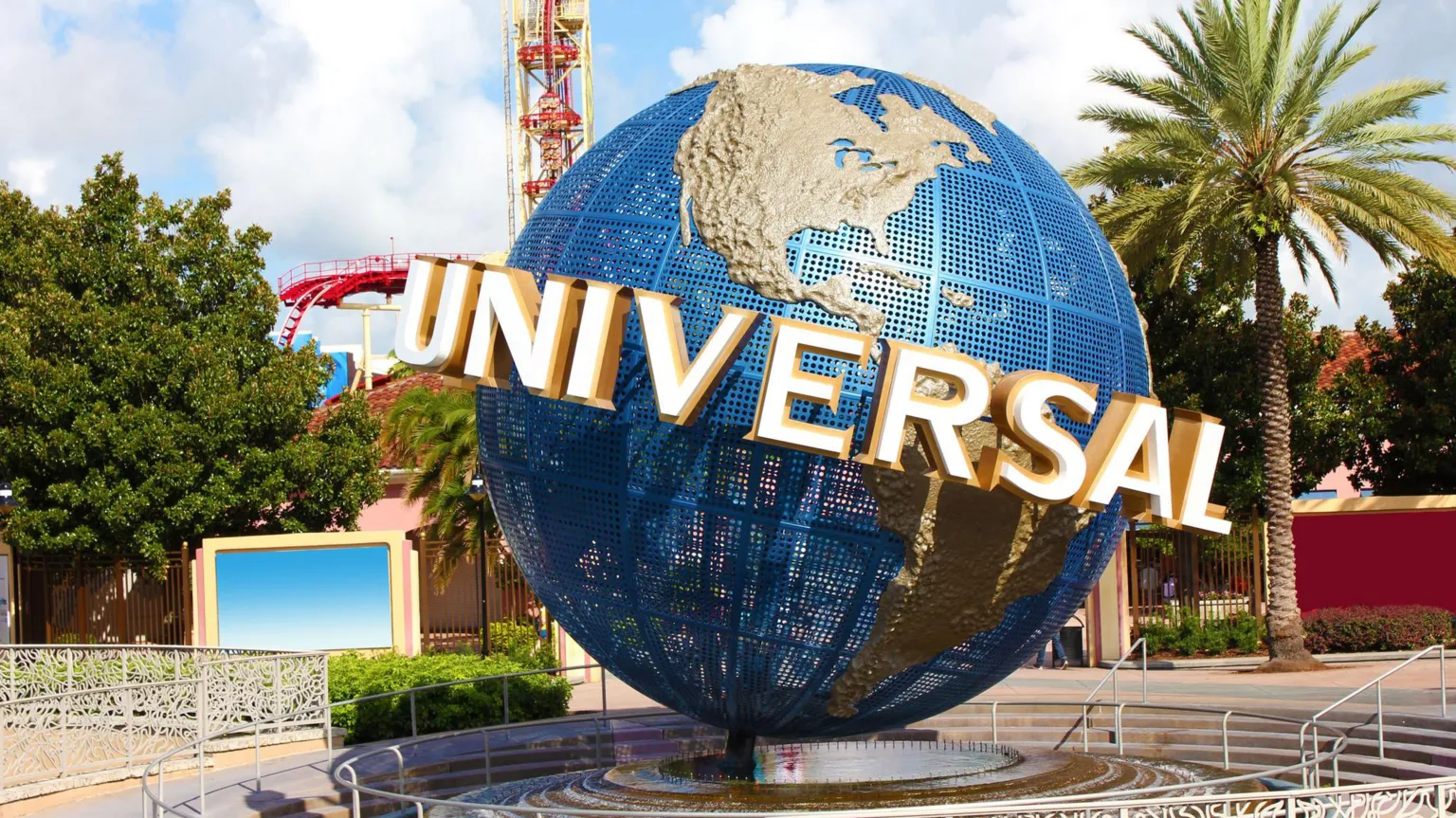 Getty Images A view of the Universal globe outside the entrance to the Florida park. A roller-coaster and other rides can be seen in the background.