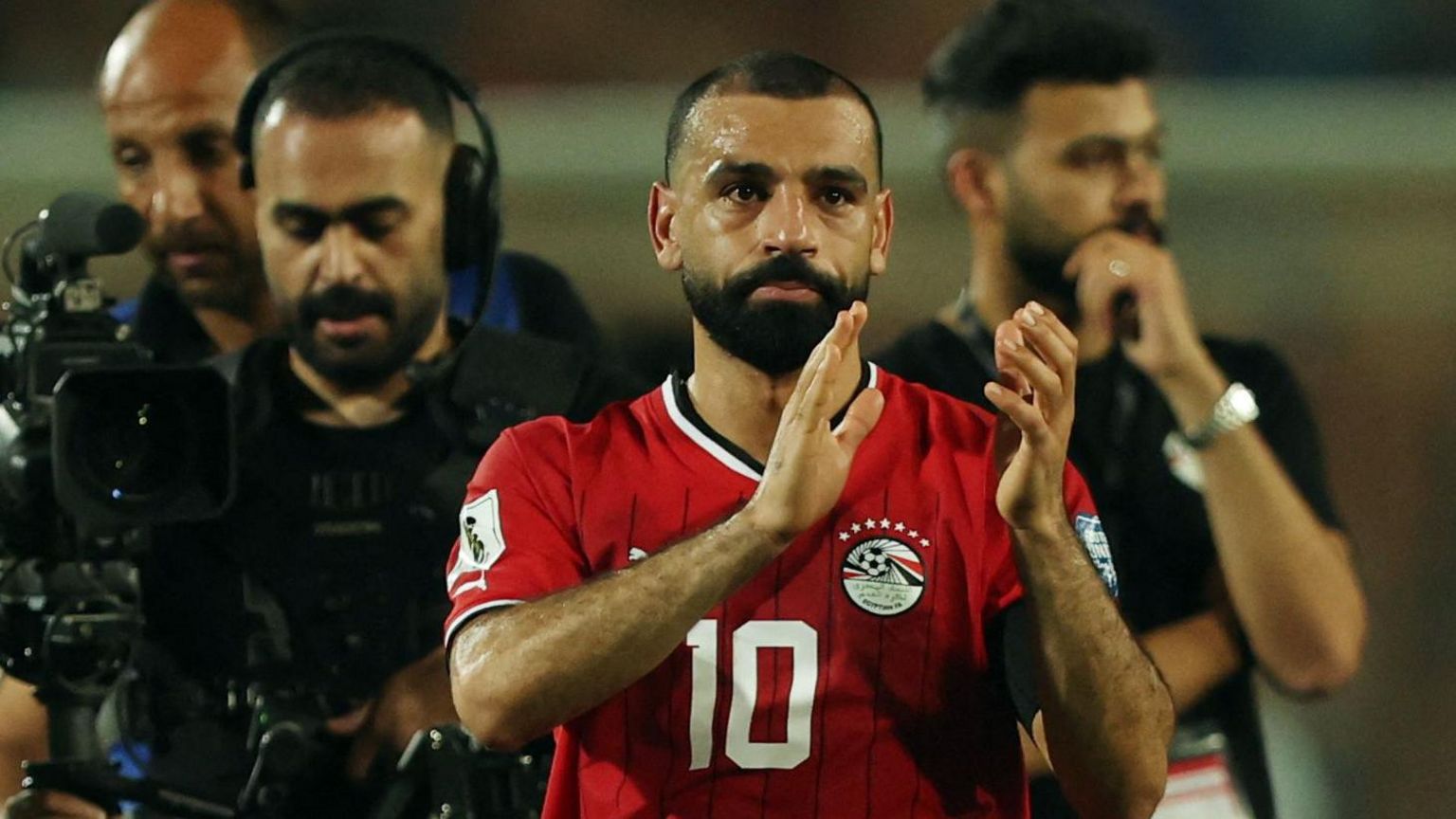 Mohamed Salah applauds fans after Egypt win a match