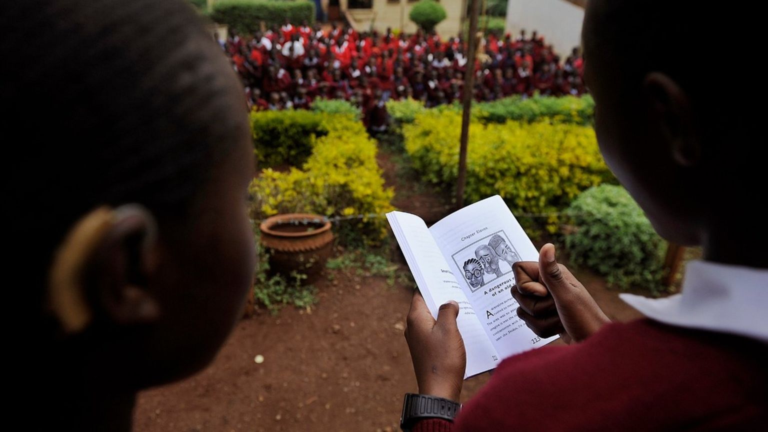 Two pupils read a book in Kenya