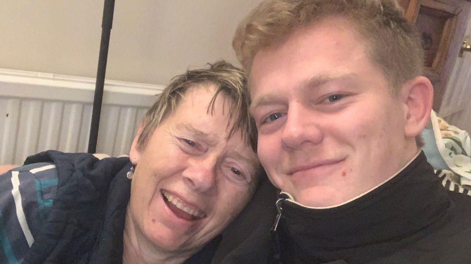 Alex Welford with his arm around his mum Alison