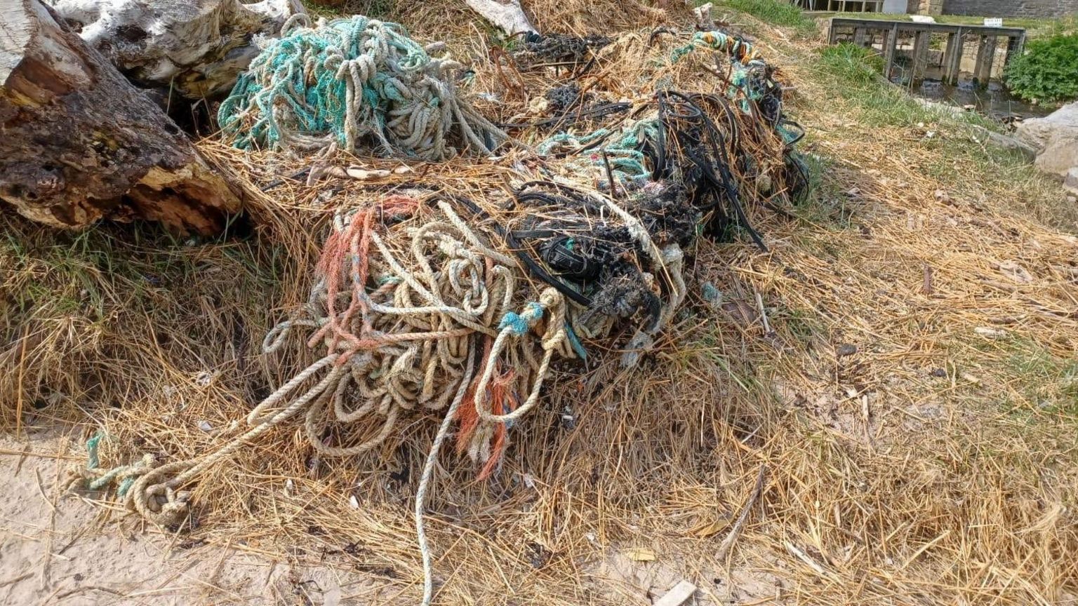 A pile of fishing tackle covered in storm debris