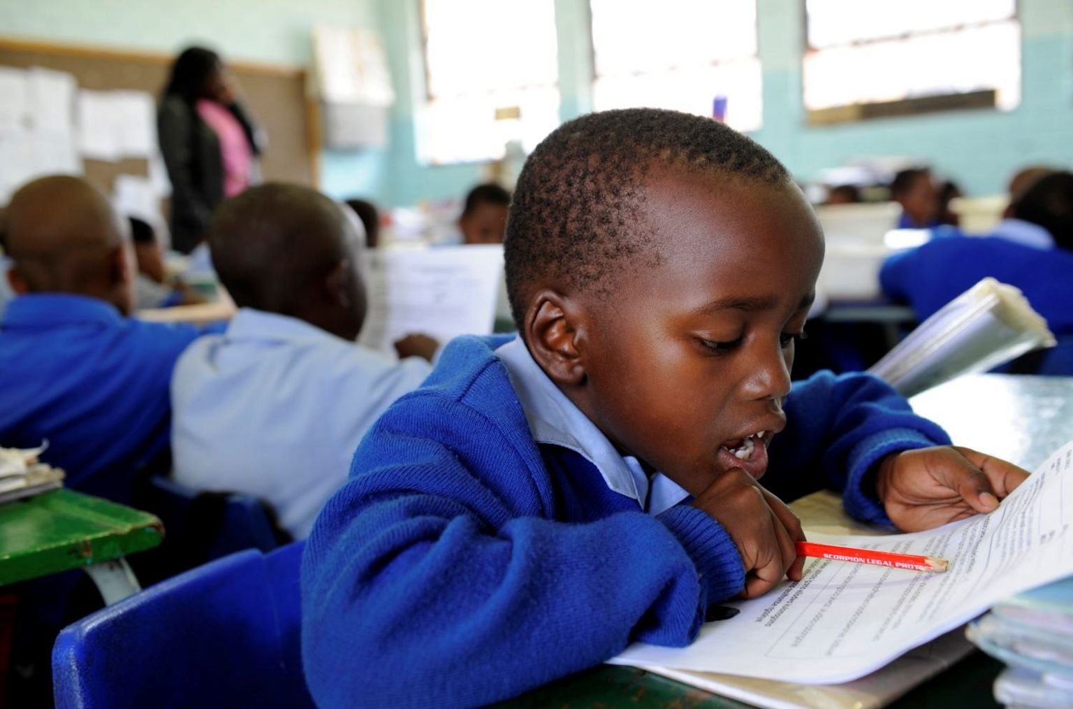 Children sitting in an exam room.