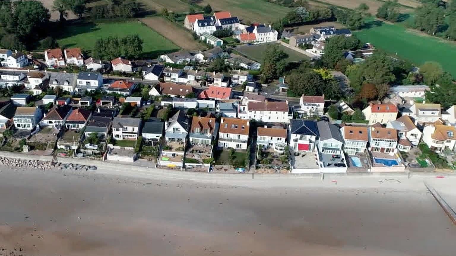 Aerial view of houses in Jersey viewing the beach