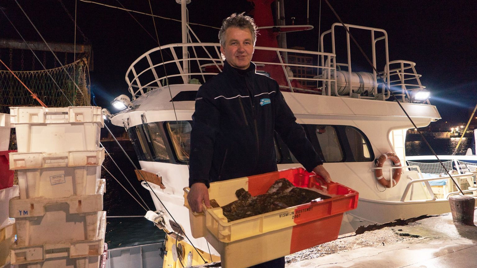 Fisherman, Job Shot, returning with a catch of fish