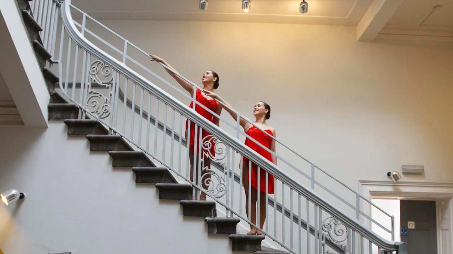 Two ballet dancers on a stair case