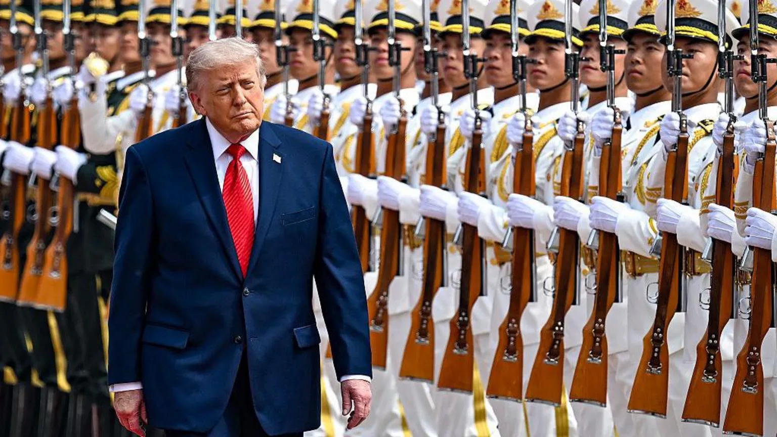 Getty Images US President Donald Trump reviews an honor guard with Chinese President Xi Jinping during a welcome ceremony at the Great Hall of the People on May 14, 2026 in Beijing,